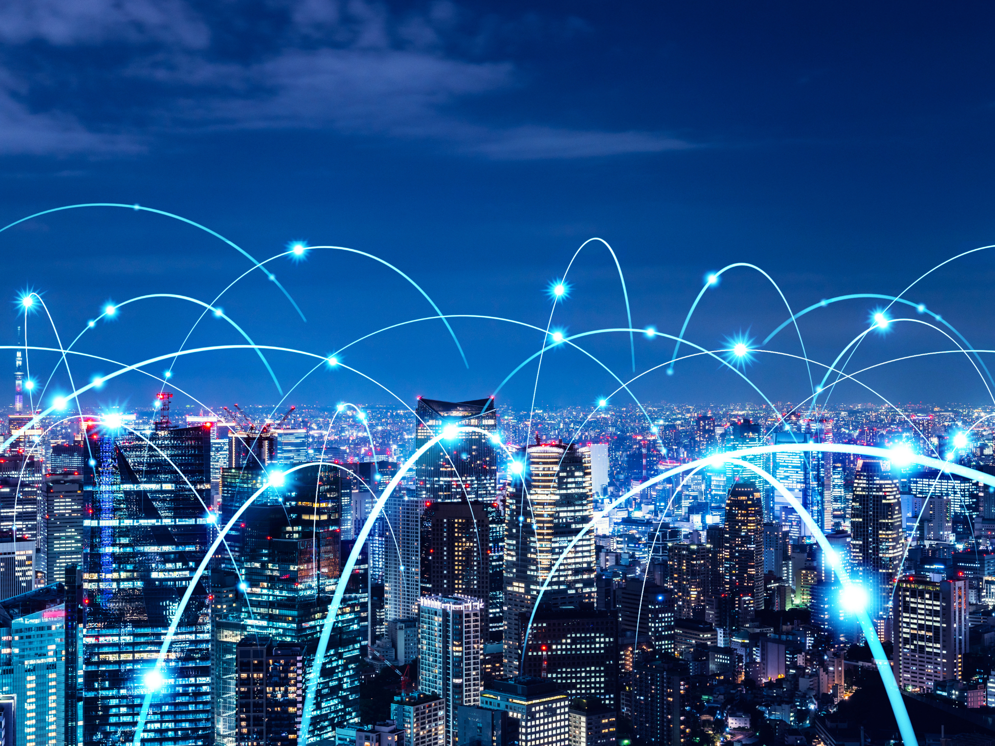 City skyline with digital network connections representing 5G Advanced and enterprise edge AI connectivity.
