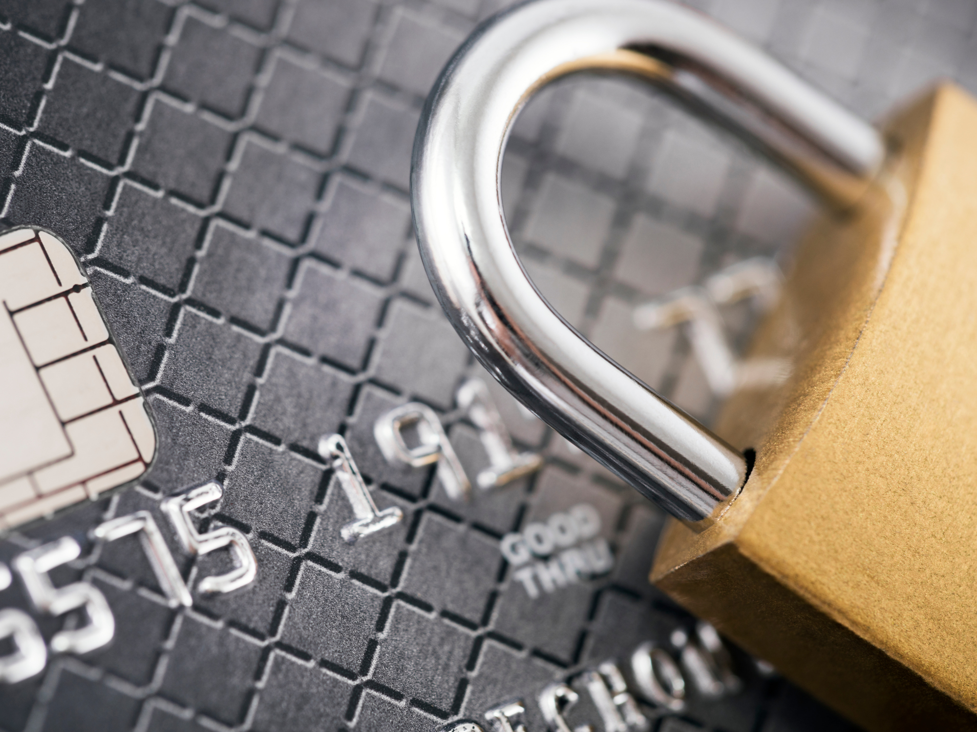 Padlock on a credit card symbolising secure payment solutions, card data protection and PCI DSS compliance.