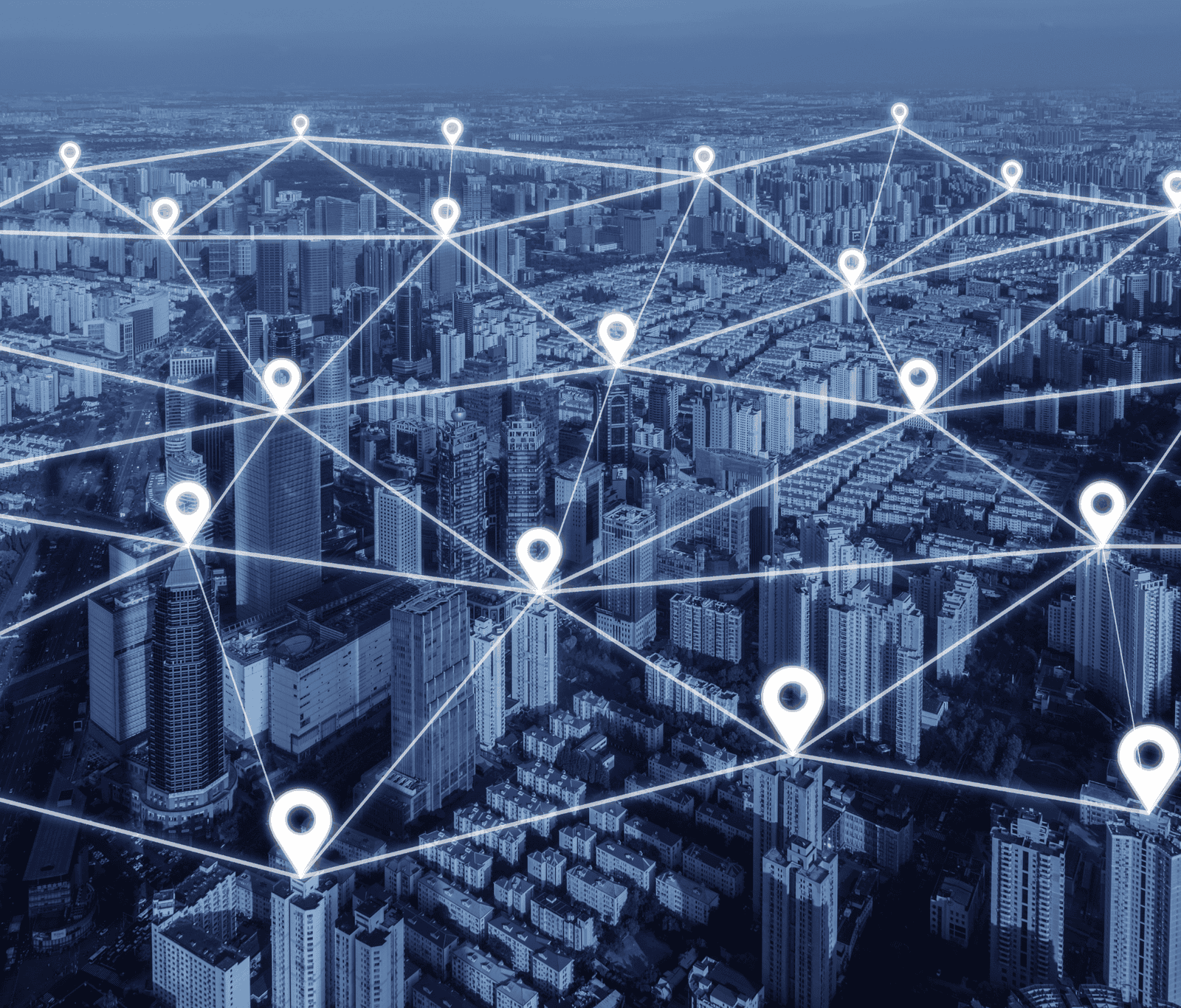 Cityscape with interconnected location pins and network lines, representing a WAN (wide area network) linking multiple sites with reliable 4G and 5G connectivity across urban infrastructure.